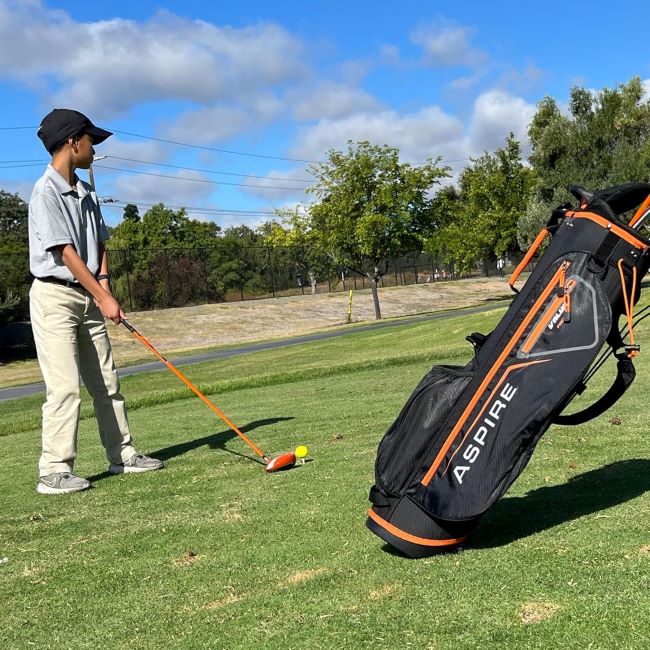 Aspire X-Lite kids golf clubs showing complete set with headcovers and carry bag