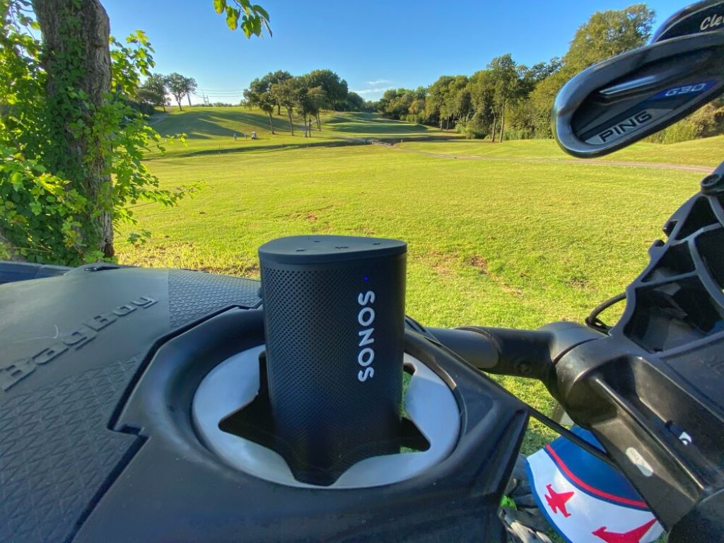 Close-up of a waterproof golf speaker designed for outdoor use and clear sound